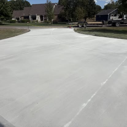 Wide driveway apron at front of home