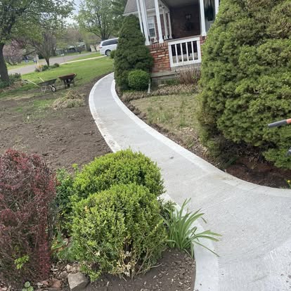 Curved front-yard walkway through landscaping